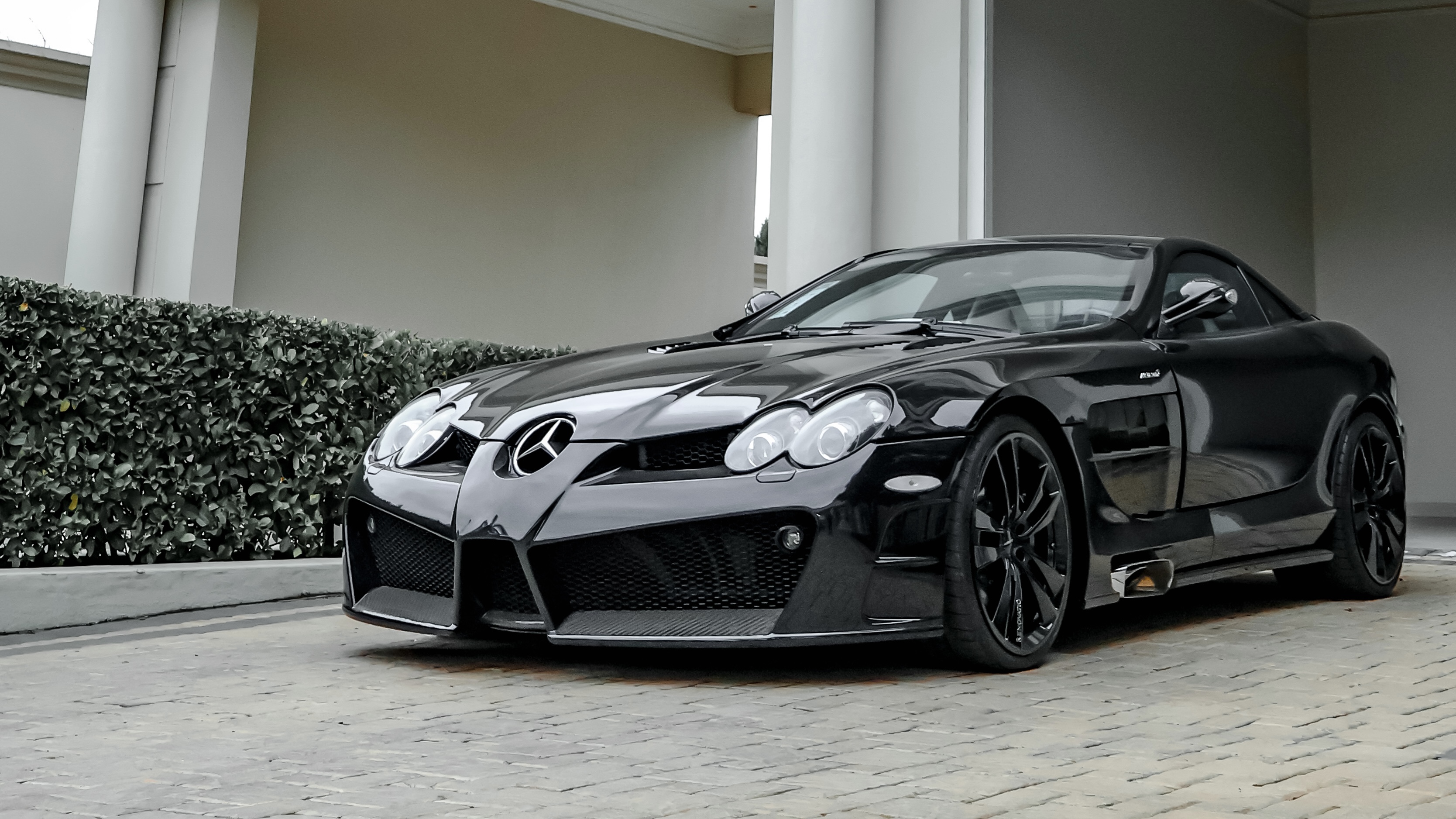 Black Mercedes-Benz SLR outside the showroom